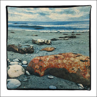 textile print of seaside boulders and embroidered sea life